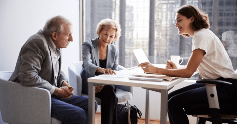 Older couple talking to a financial adviser